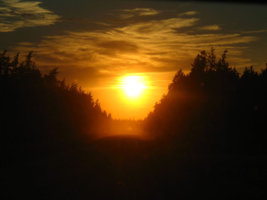Sunset on a dusty road to a construction site in Middle-of-Nowhere, northern Alberta during my first co-op term in 2008.